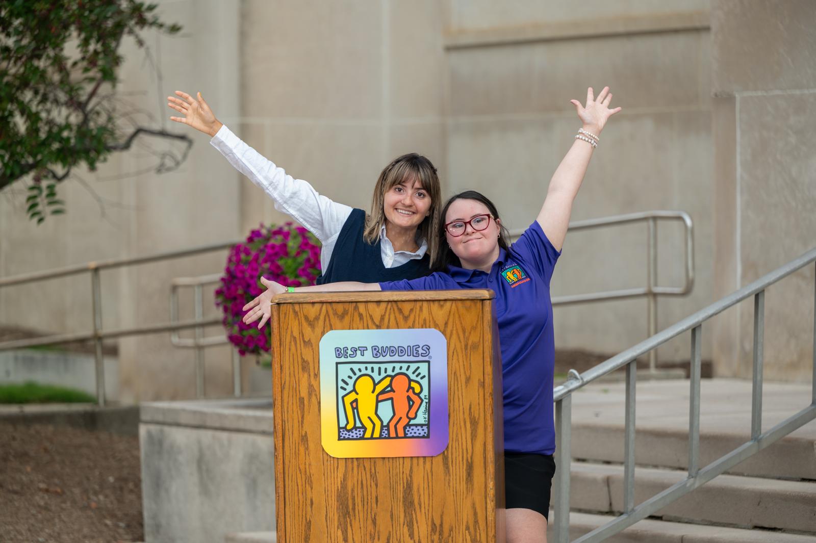 Lauren and her buddy at Best Buddies podium